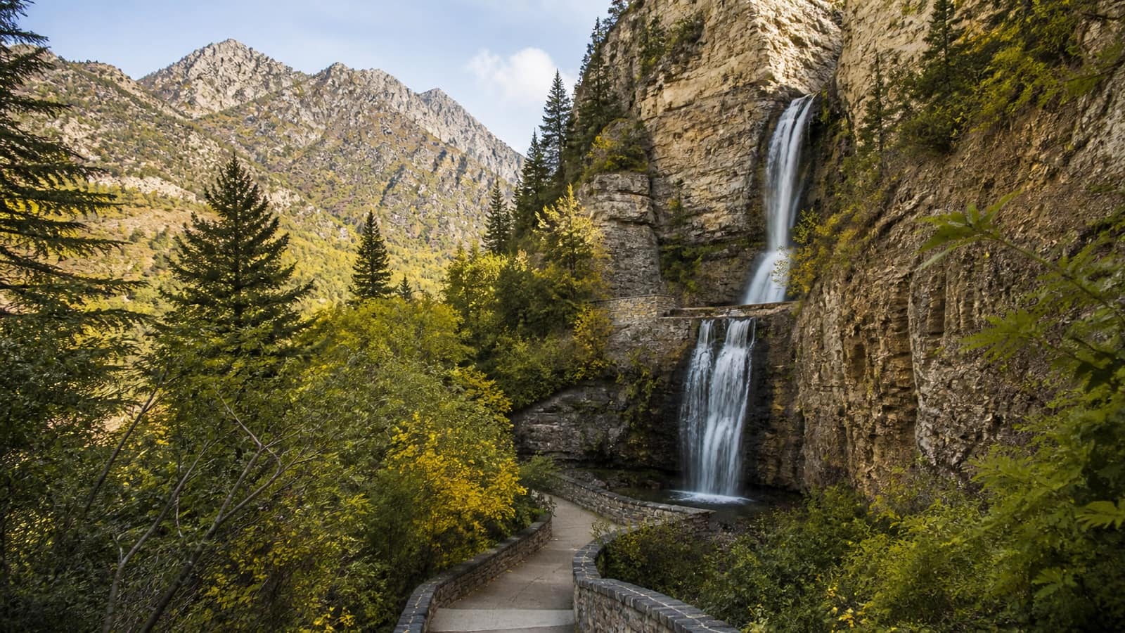 Tall waterfall in a forested Wasatch Range canyon, Utah